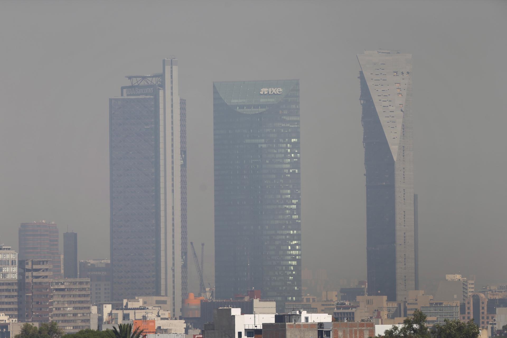 Buildings shrouded in smog in Mexico City