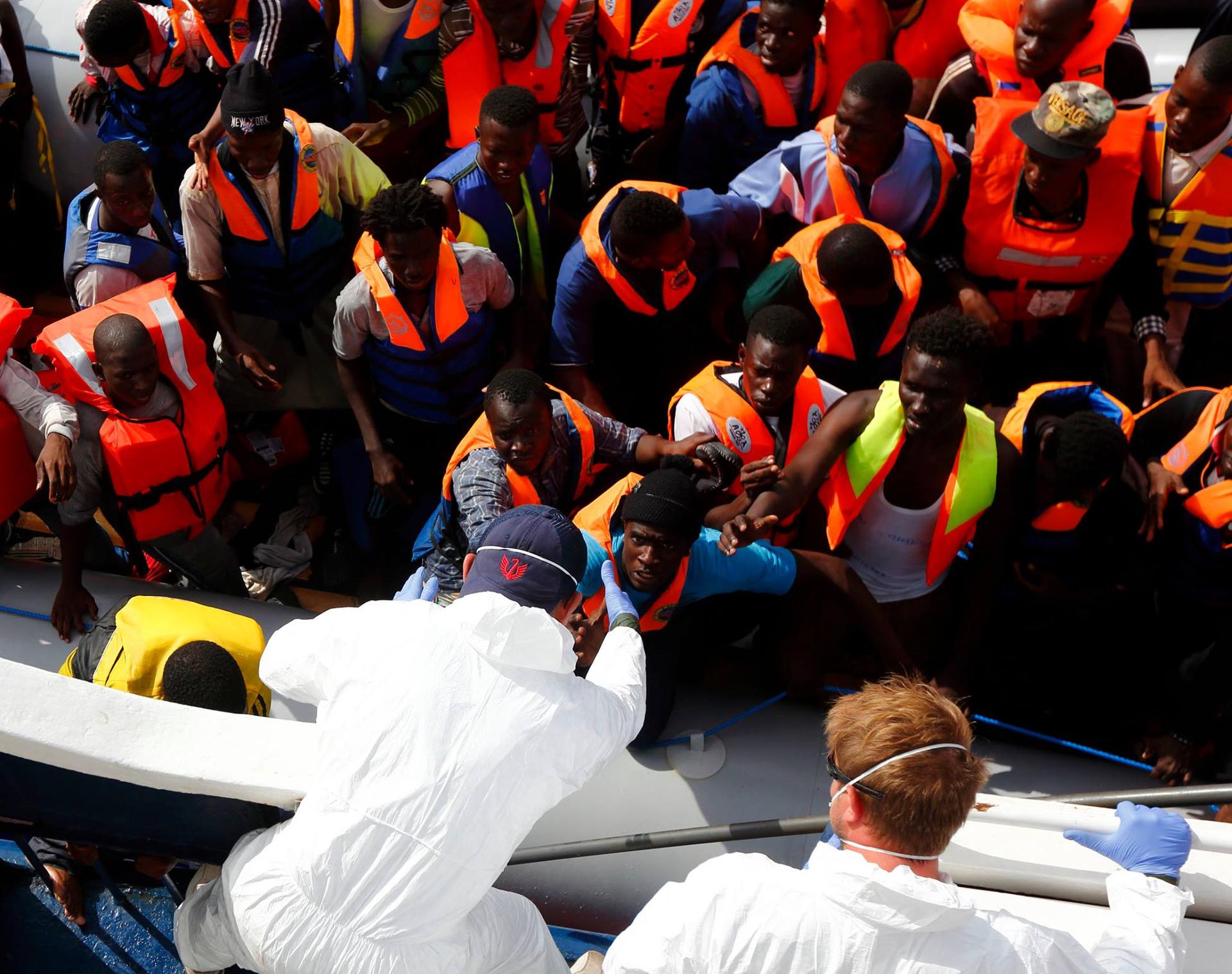 Migrants attempting to cross the Mediteranean being assisted by MOAS.