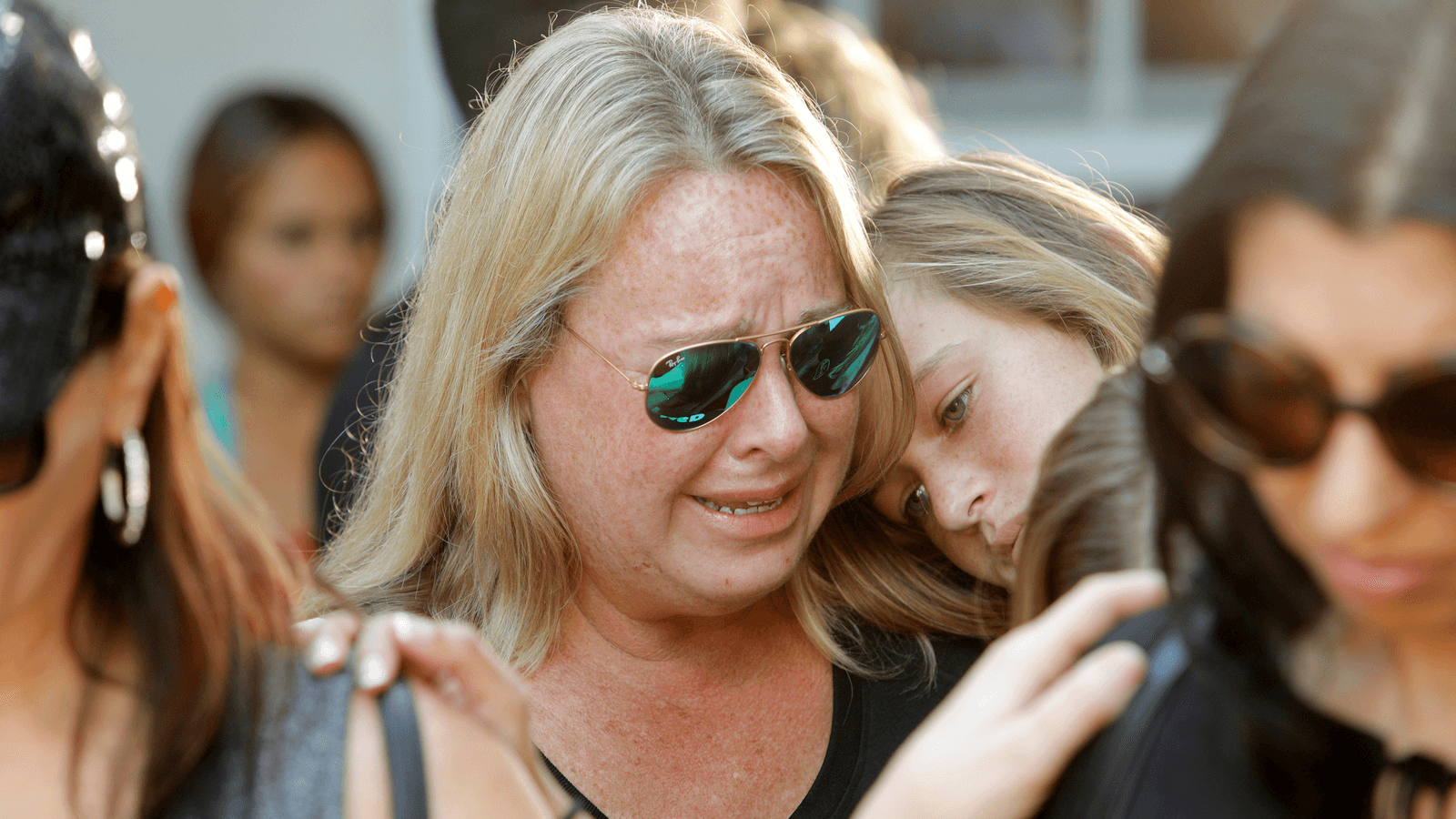 Mourners react during a community prayer vigil for victims of yesterday's shooting at nearby Marjory Stoneman Douglas High School in Parkland, at Parkridge Church in Pompano Beach, Florida, Feb. 15, 2018.