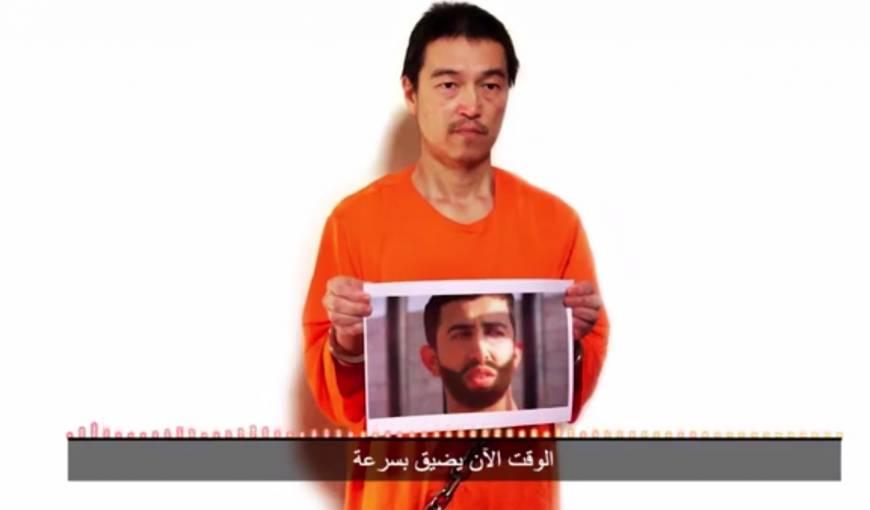 Screenshot of the video message from the Islamic State, in which a man believed  to be Kenji Goto warns that there are only 24 hours left to save his life and even less time for a Jordanian air force pilot Muath al-Kasasbeh, who is also being held hostage
