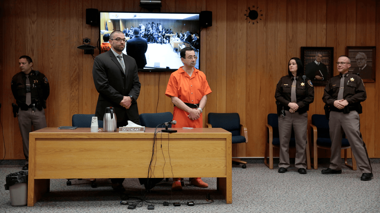 Larry Nassar, a former team USA Gymnastics doctor who pleaded guilty in November 2017 to sexual assault charges, and his defense attorney Matt Newburg stand during Nassar's sentencing hearing in the Eaton County Court in Charlotte, Michigan, Feb. 5, 2018.