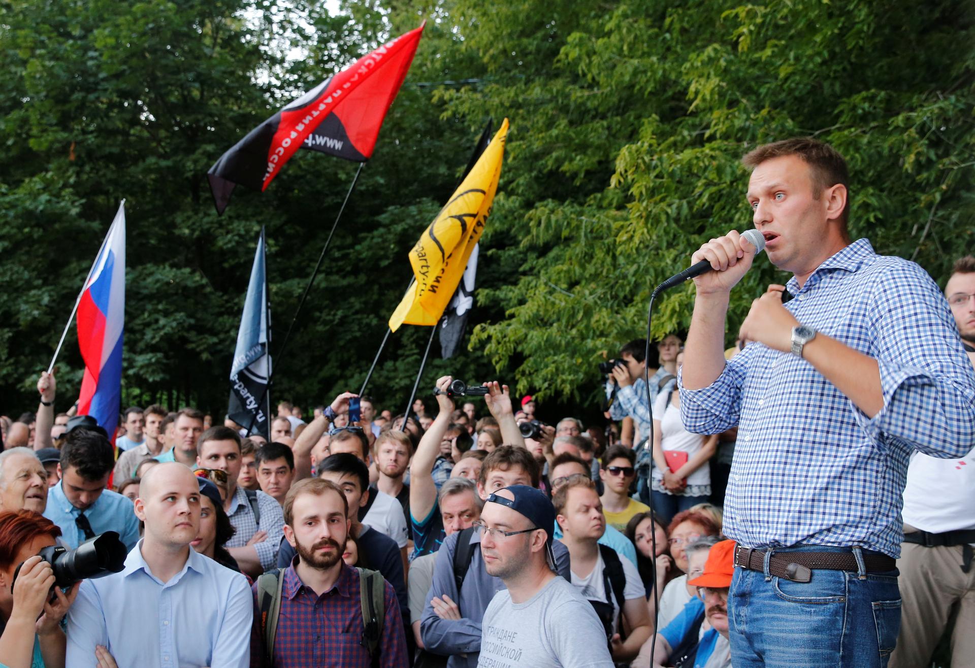 Russian anti-corruption campaigner and opposition figure Alexei Navalny addresses a protest against new anti-terrorism legislation approved by President Vladimir Putin, in Moscow's Sokolniki park, Russia, Aug. 9, 2016. 