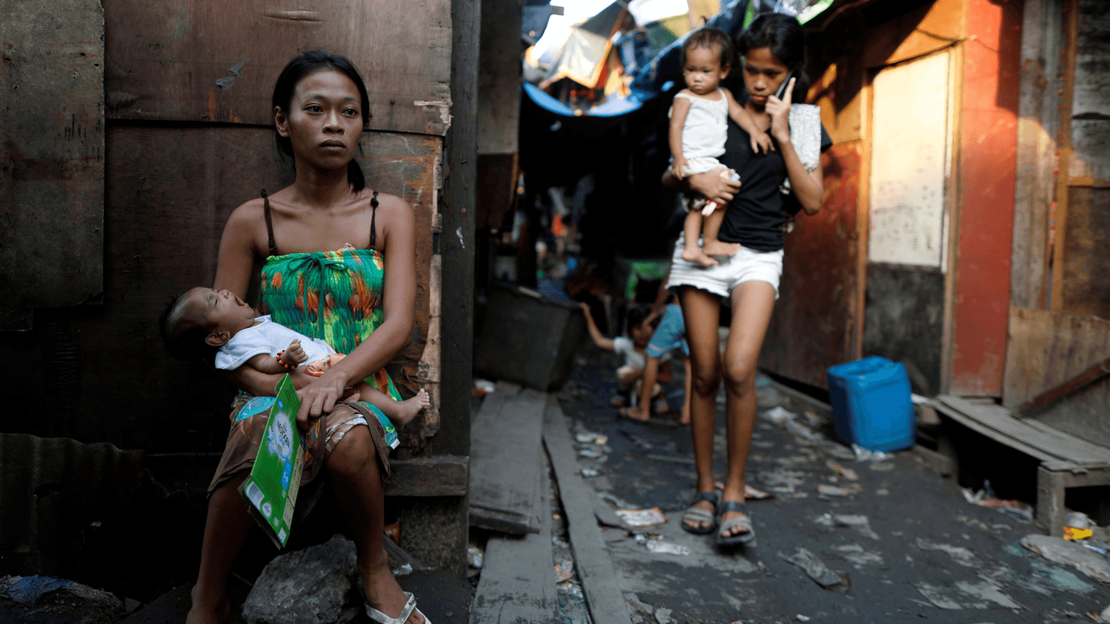 Residents are seen outside their shanties in Navotas, Metro Manila, Philippines, where Jazmine Durana lives, Oct. 28, 2017. 