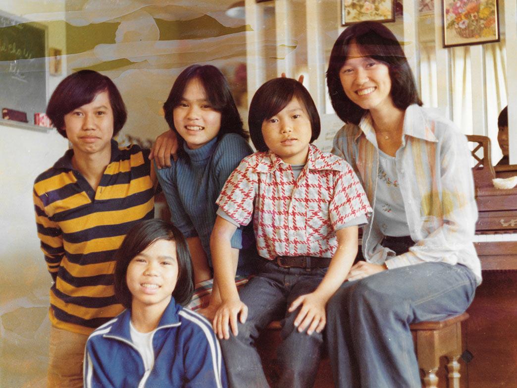 The Truong family arrived to the United States not long after fleeing Vietnam in 1975, when the then-capital of South Vietnam, Saigon, fell to the North Vietnamese army. Thu-Thuy Truong, far right, places bunny ears above her brother, Sy.