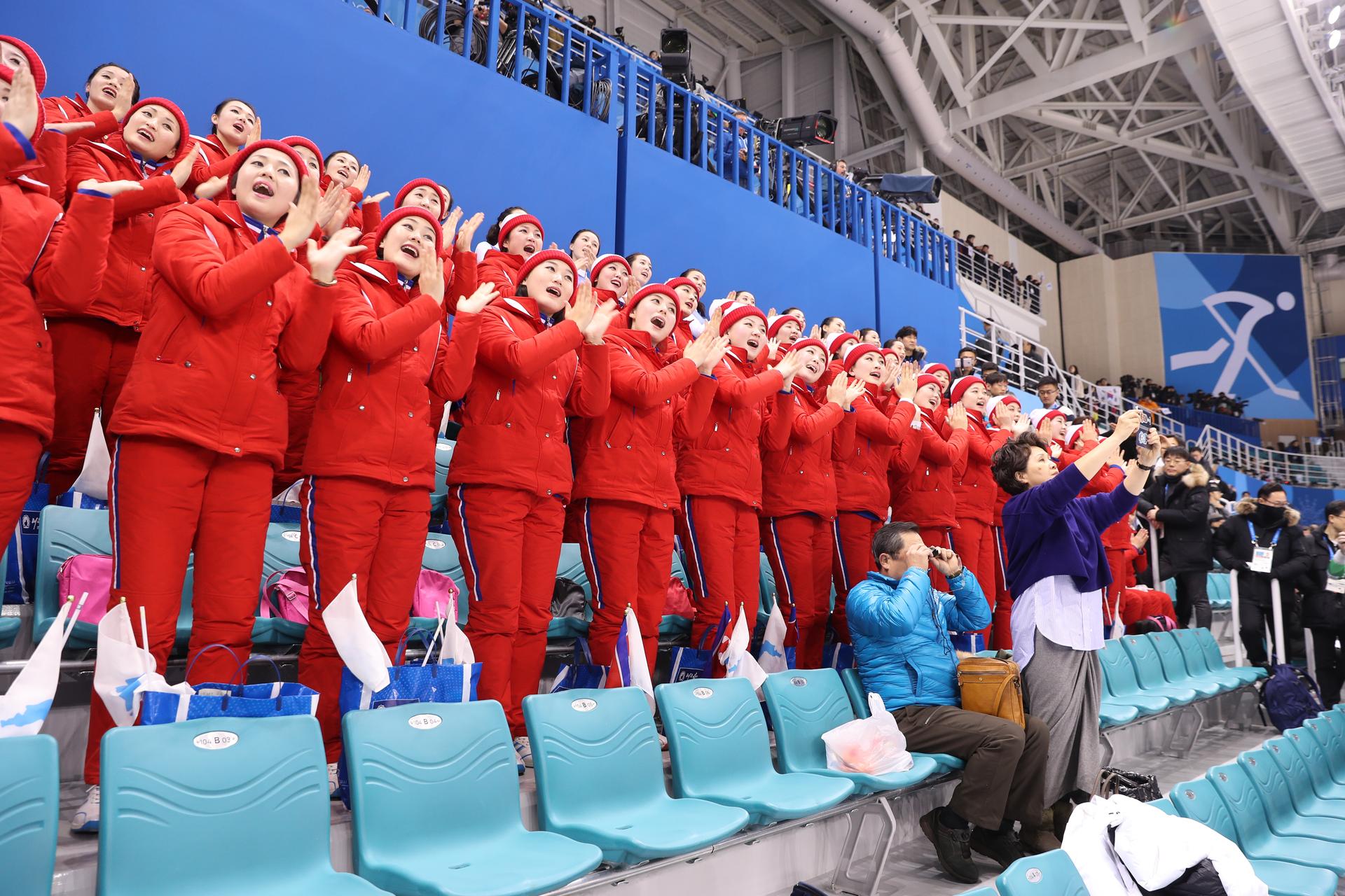 North Korean cheerleaders root for the joint Korean women's hockey team.