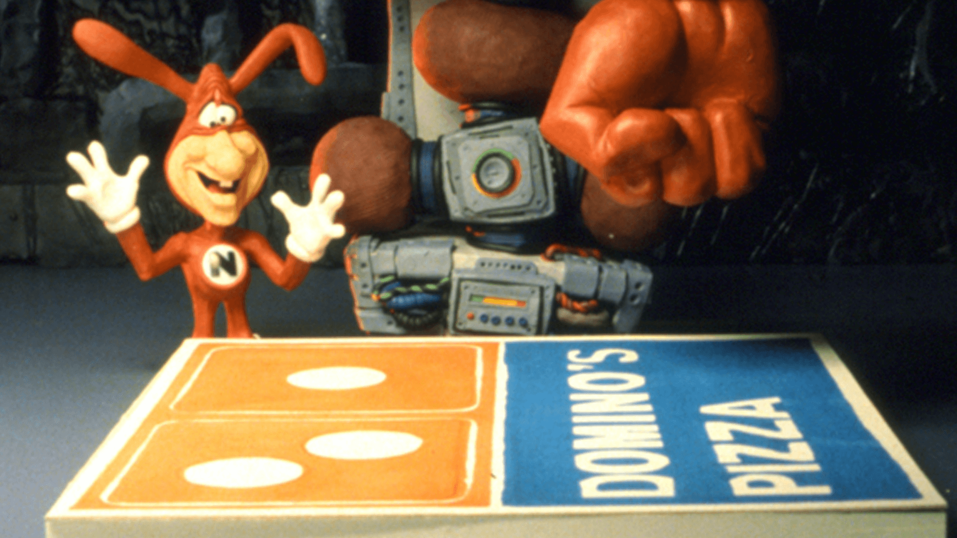 A Domino’s commercial featuring The Noid.