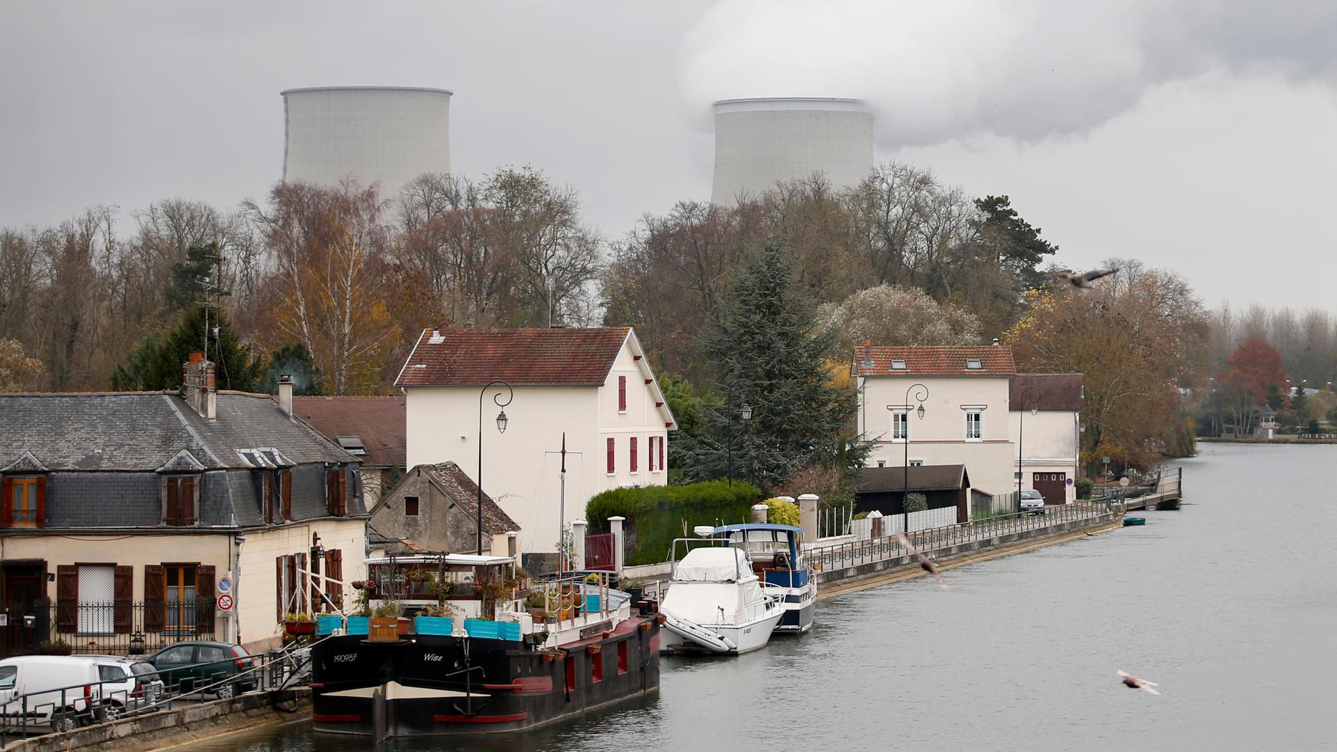 Steam rises from the cooling towers of the Electricite de France (EDF) nuclear power station at Nogent-Sur-Seine, France. The nuclear industry, and some of the world's top climate scientists, are arguing at the Paris climate talks that nuclear energy must