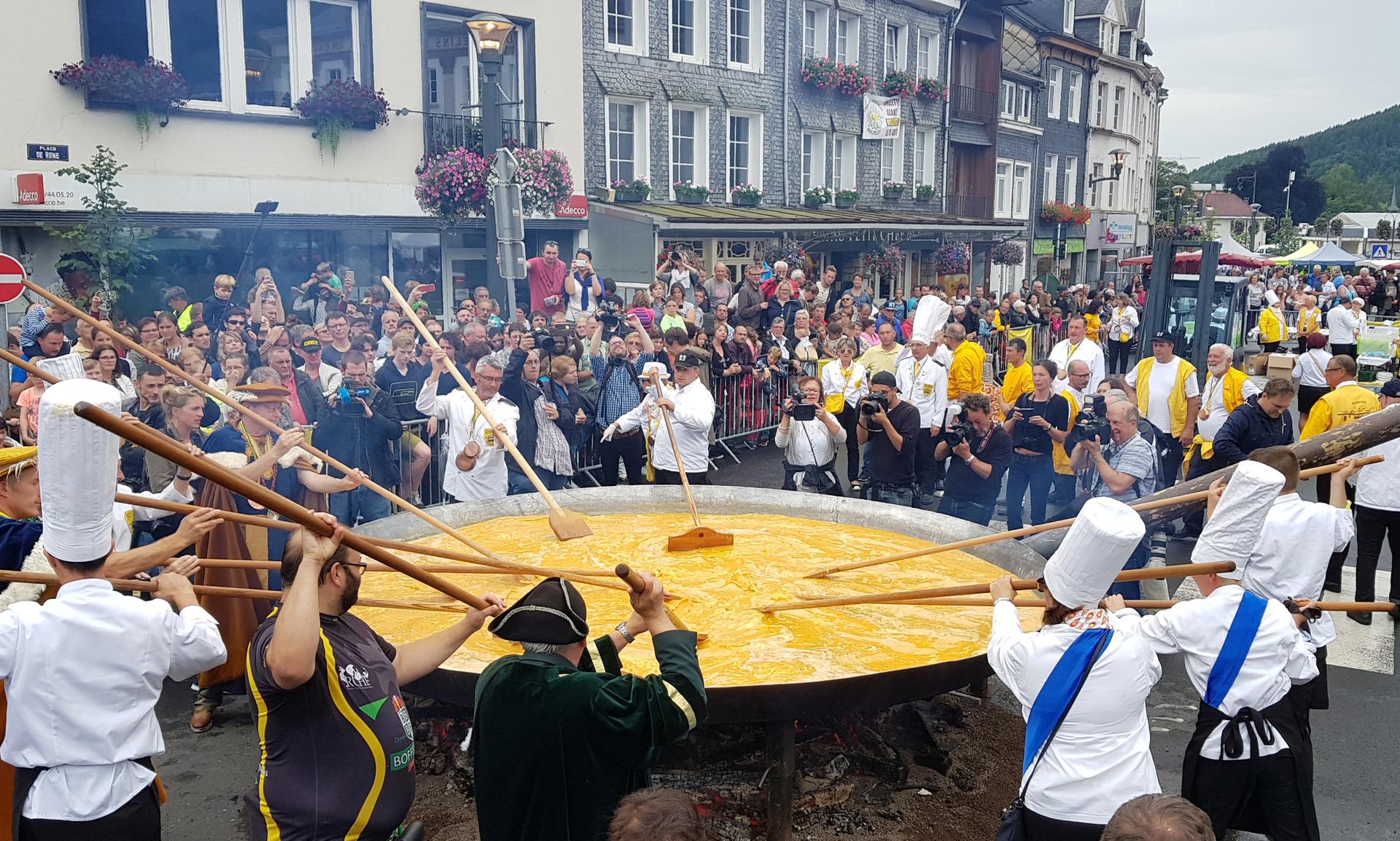 Members of the worldwide fraternity of the omelette prepare a traditional giant omelette