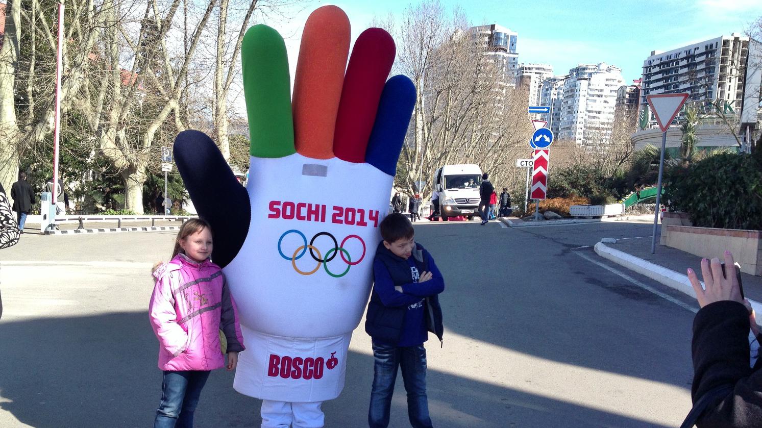 Children pose for a picture outside of the Sochi Olympic Park.
