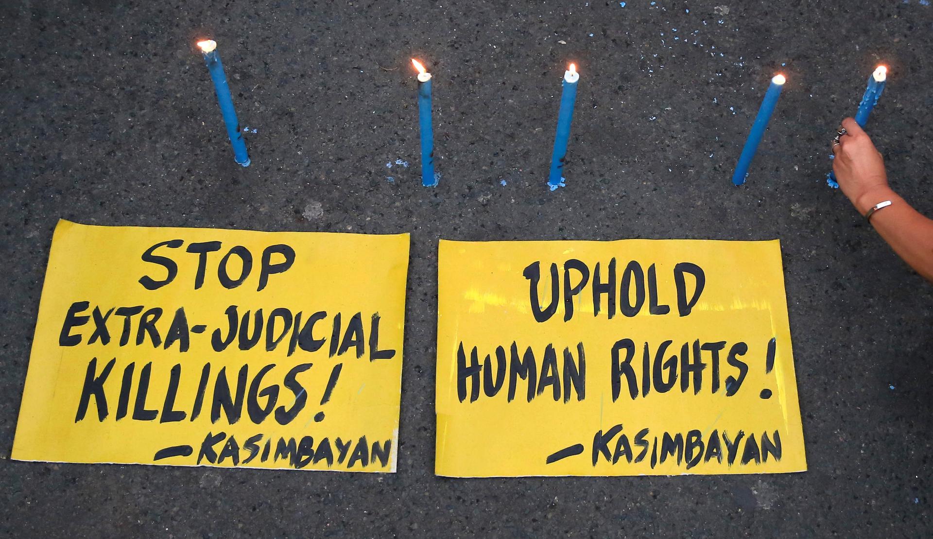 Human rights advocates offers prayers and lights candles