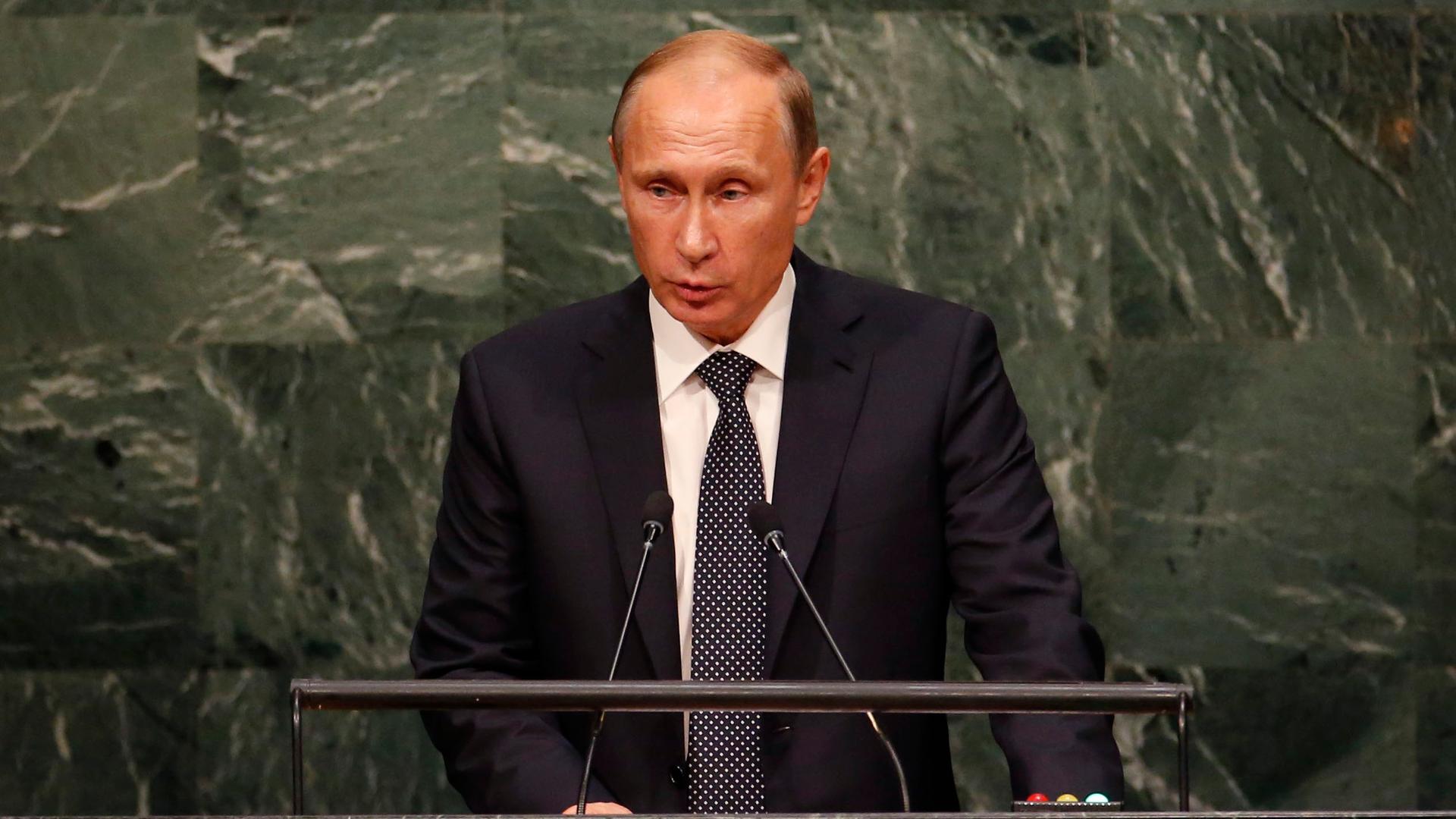 Russian President Vladimir Putin addresses attendees during the 70th session of the United Nations General Assembly at the UN Headquarters in New York, September 28, 2015.
