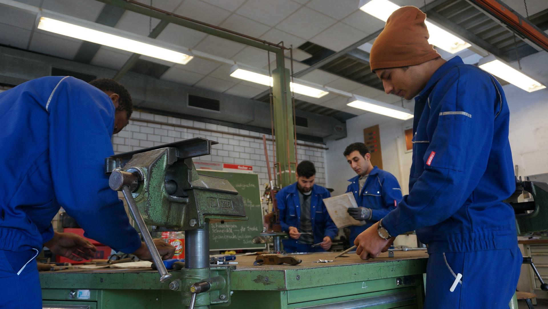 At the Cottbus Chamber of Crafts trainees enrolled in a refugee training program prepare for the day's metalworking assignment, in Cottbus, Brandenburg, Germany, Jan. 11, 2017.