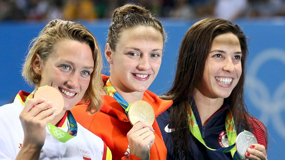 women athletes swimming with medals in Rio Olympics 2016