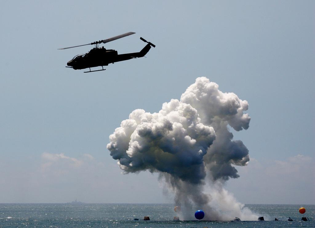 A US-made AH-1W Cobra helicopter launches hellfire missiles during the annual Han Kuang No. 22 Military Exercise in Ilan county, 49 miles west of Taipei July 20, 2006