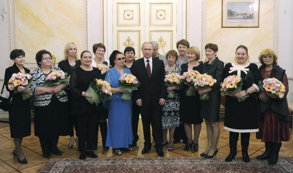 Russian President Vladimir Putin celebrates International Women's Day at the Kremlin in Moscow March 8, 2015.