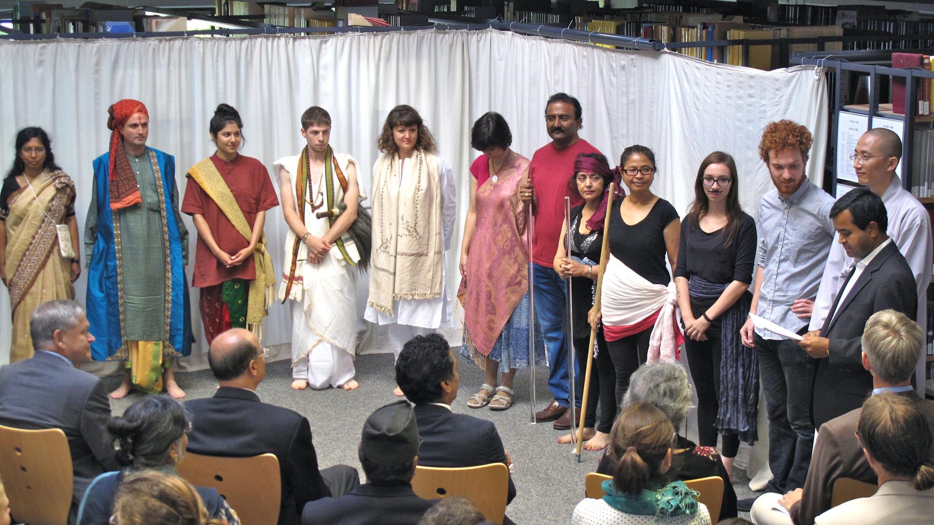 The cast of the Sanskrit play, "The Cleverness of the Thief." Patricia Sauthoff is in the center, wearing white.  