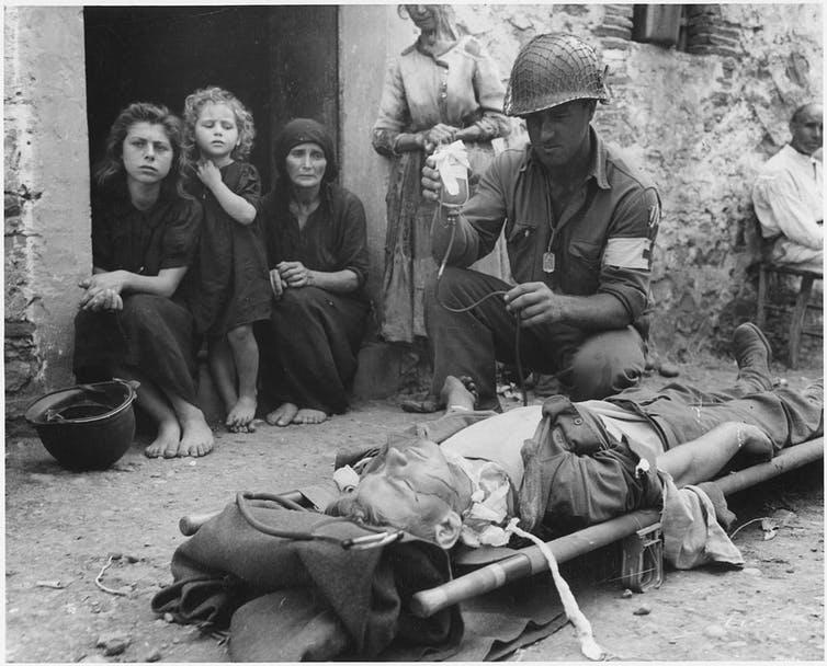 Sicily, 1943: Whose blood was this U.S. soldier getting?