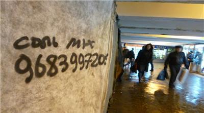 The telephone number of a "spice" dealer written on a wall outside a Moscow train station.