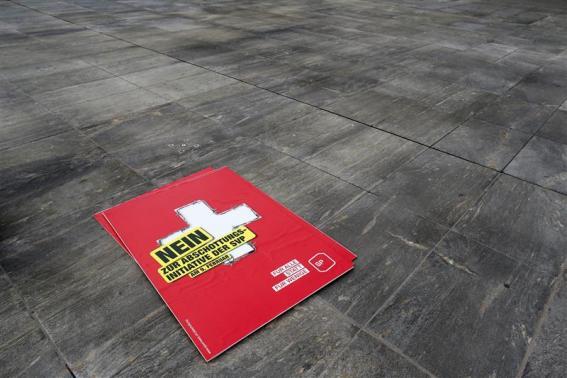  A poster against the "mass immigration initiative" of the Swiss Socalist Party SPS is seen on the Federal Square before a campaign in Bern. 