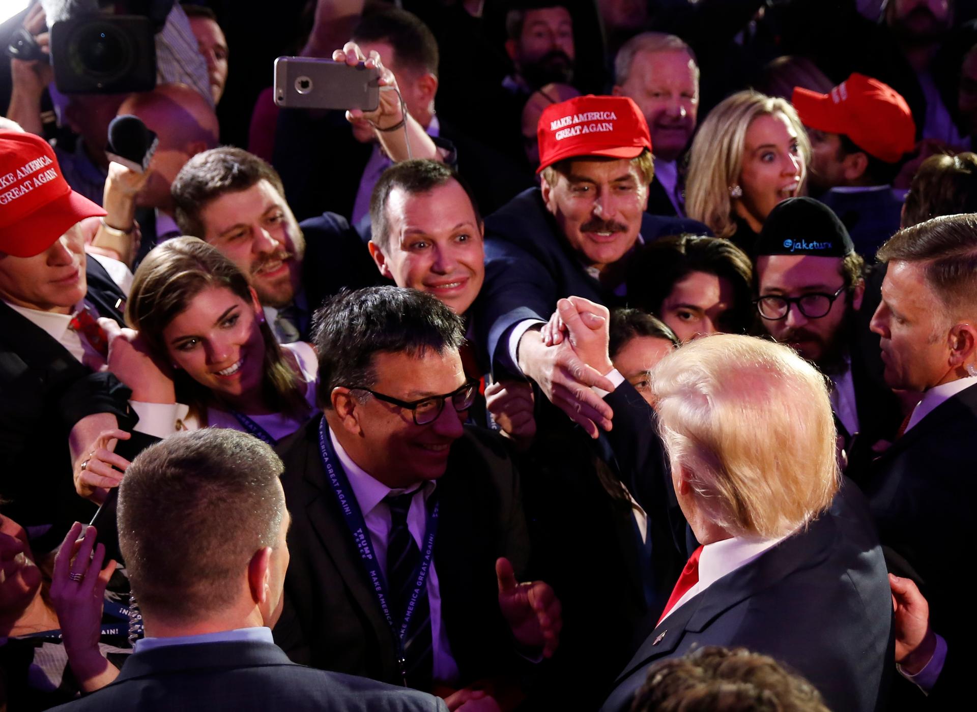 US President-elect Donald Trump greets supporters