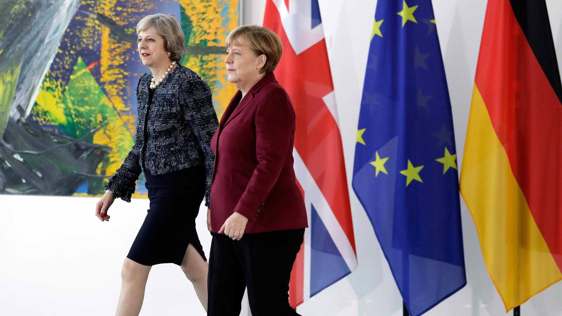 German Chancellor Angela Merkel and Britain's Prime Minister Theresa May arrive for a statement prior to a meeting at the chancellery in Berlin, Germany, November 18, 2016. 