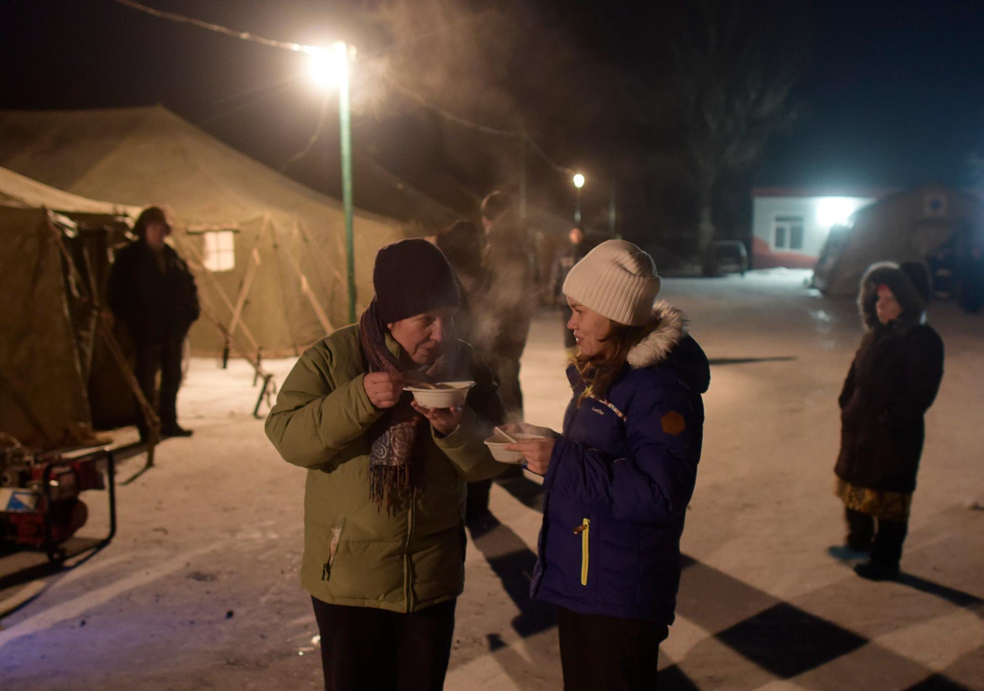 Local residents have a meal at an emergency center after shelling hit supply infrastructure in the government-held industrial town of Avdiyivka, Ukraine January 31, 2017.