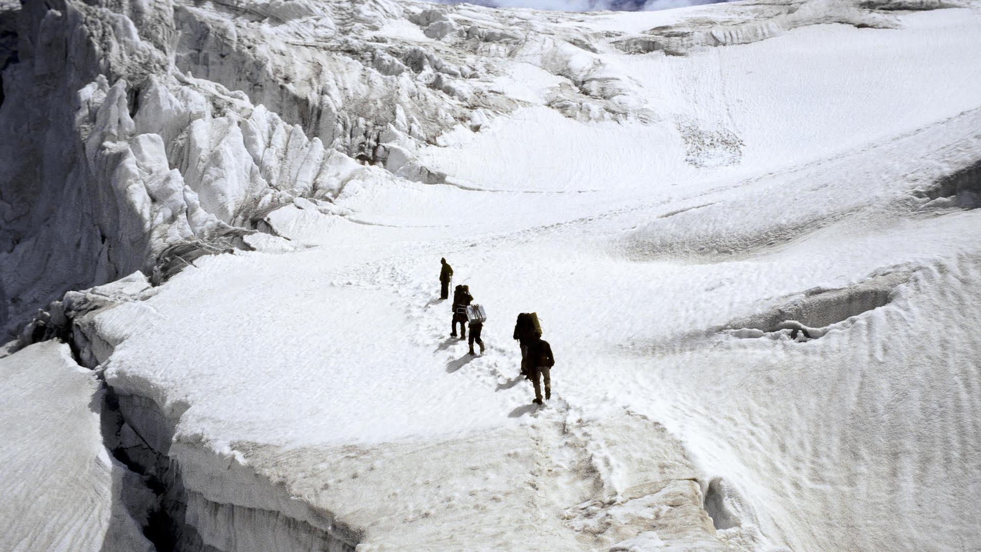 A research team crossing an ice plateau in the Indian Himalayas faced risks of hidden crevasses, storms, avalanches and earthquakes.