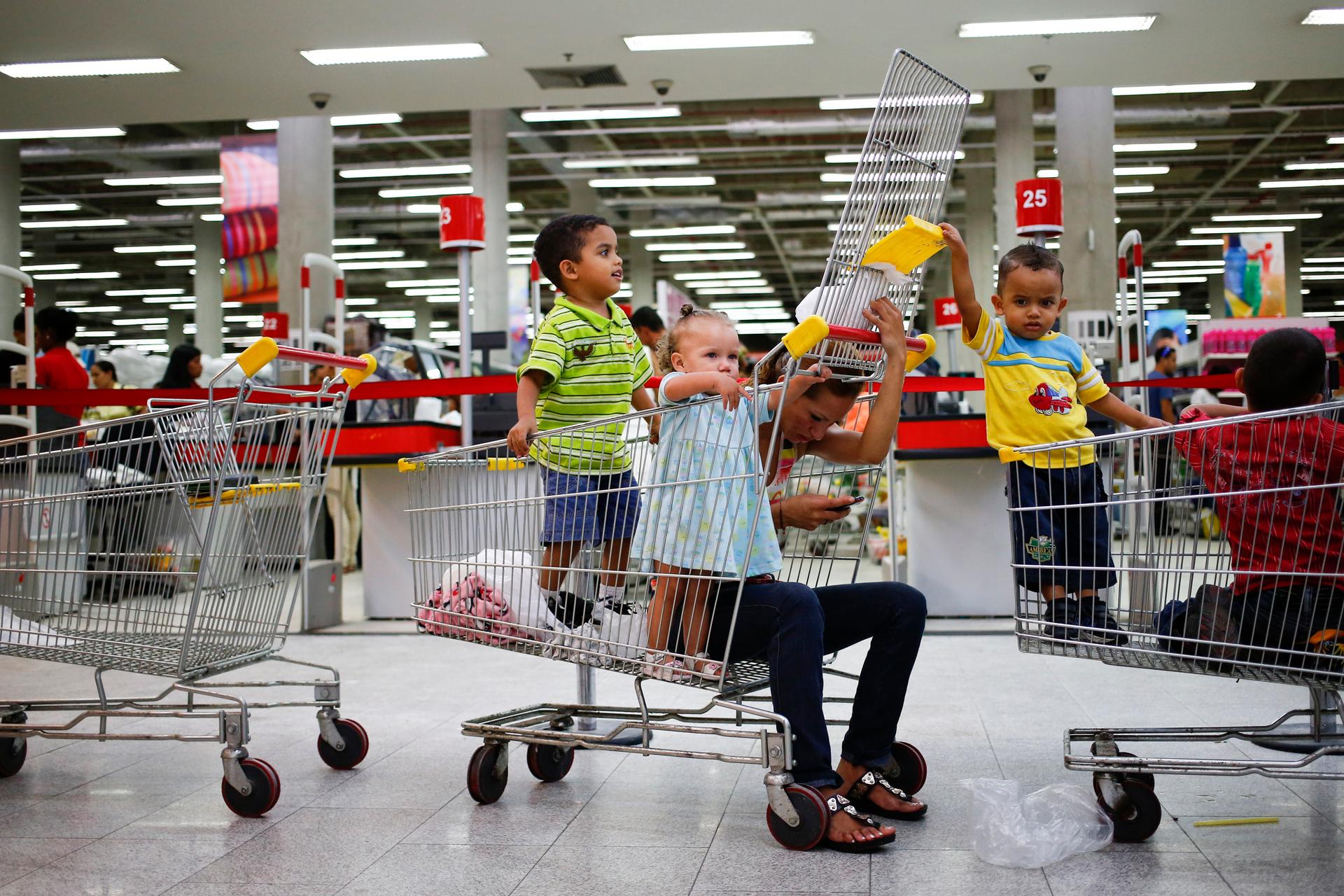 Customers at Bicentenario supermarket in Caracas