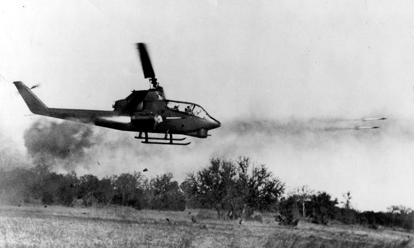 A US Huey Cobra fires rockets at an enemy target in Ia Drang, October 1965.