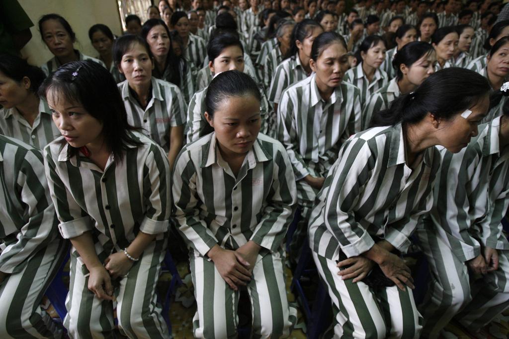 Inmates wait before they are released from Thanh Xuan prison outside Hanoi on Aug. 29, 2010. 