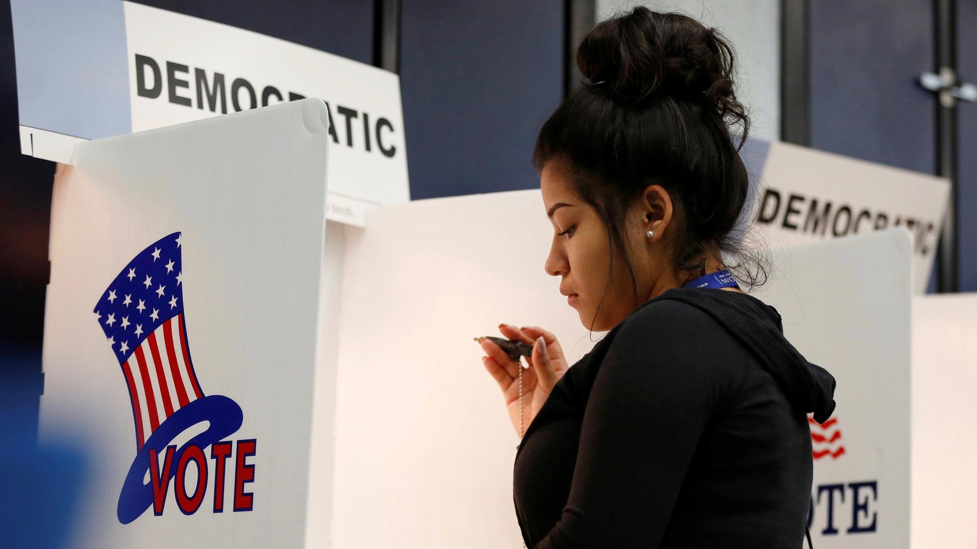Kimberly Medina, 19, votes during the U.S. presidential primary election at Gates Street Elementary School in Los Angeles, California, on  June 7, 2016. Californians will vote Nov. 8 on a ballot measure that seeks to overturn a ban on bilingual education.