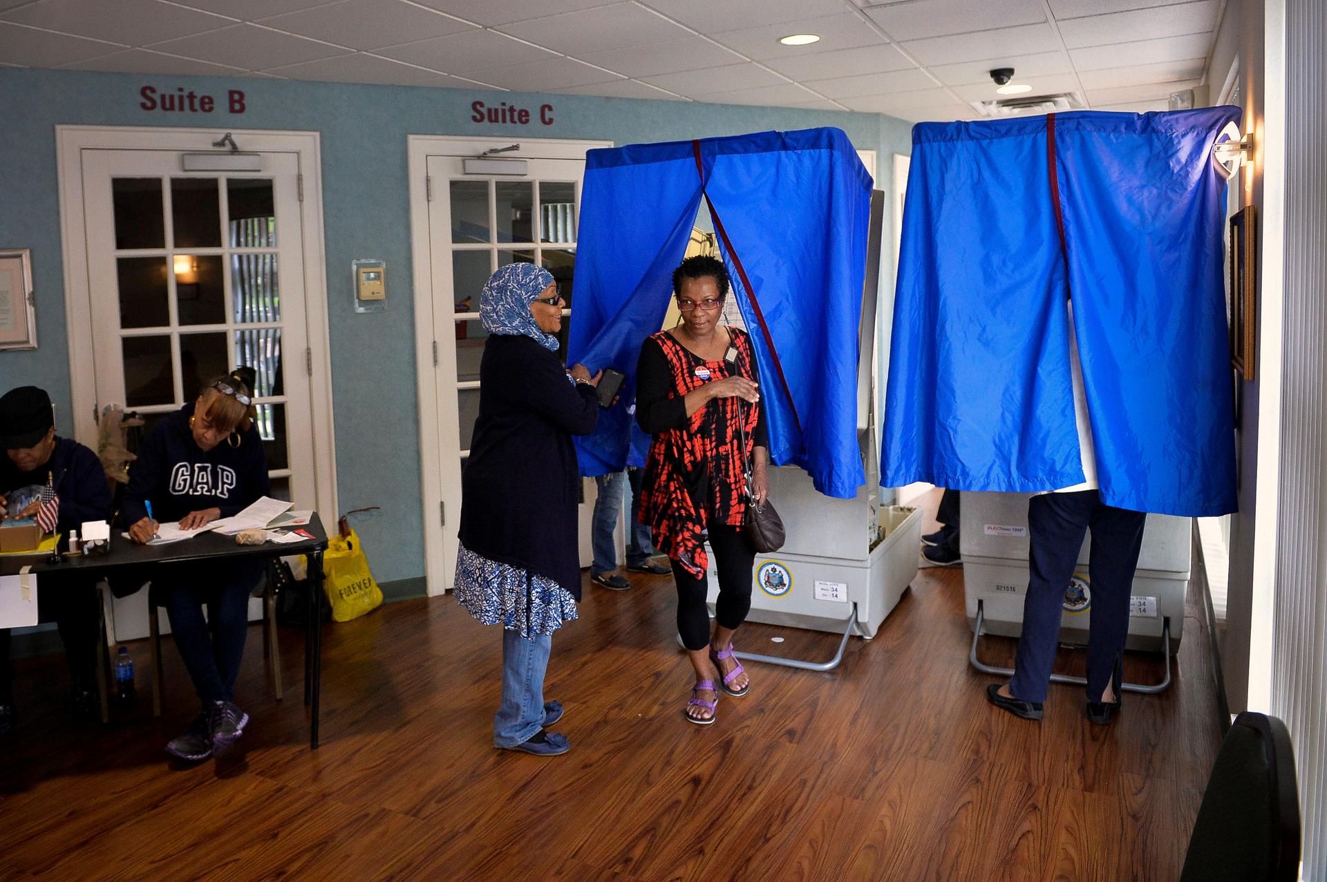 A voter exits the voting booth