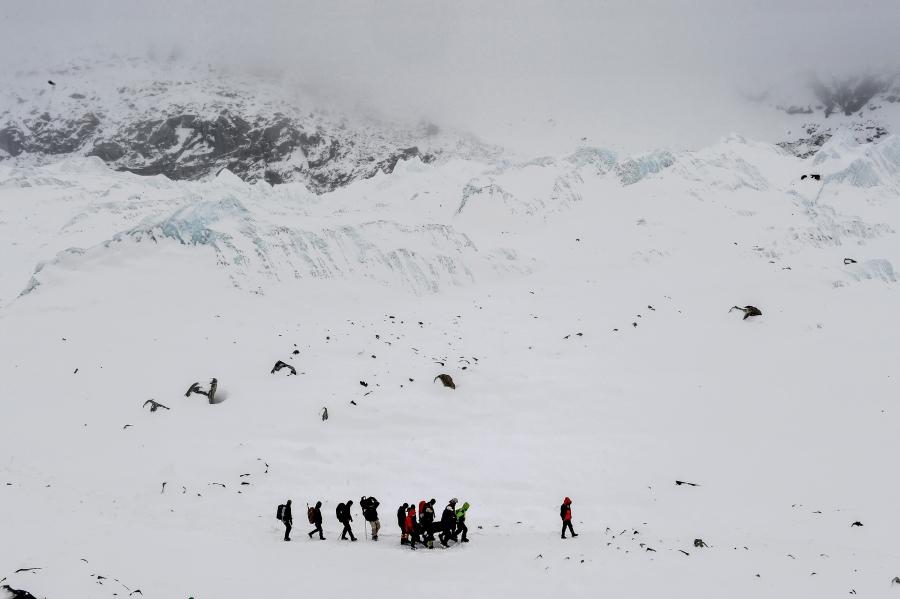 Rescuers carry an injured person to a medical tent after the avalanche hit the Everest Base Camp. Nepal, 25 April 2015.