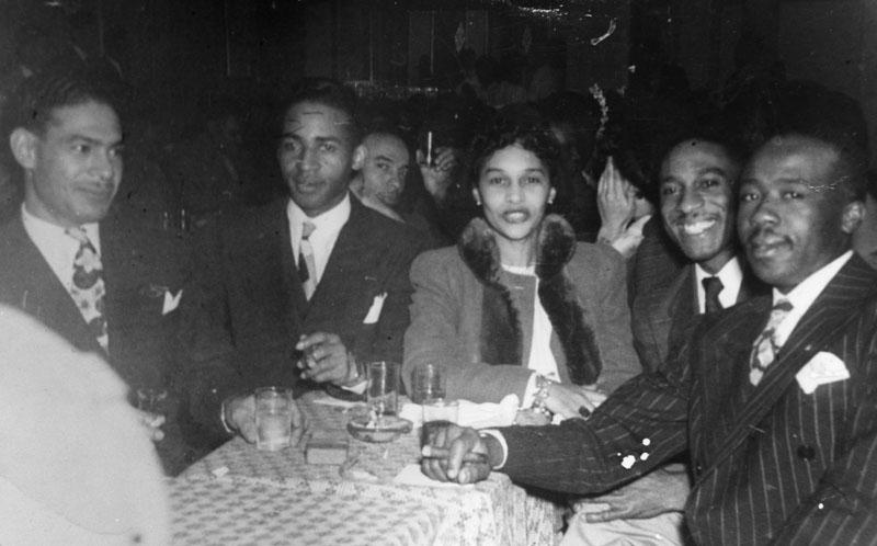 Patrons at a table at a nightclub in Bronzeville.