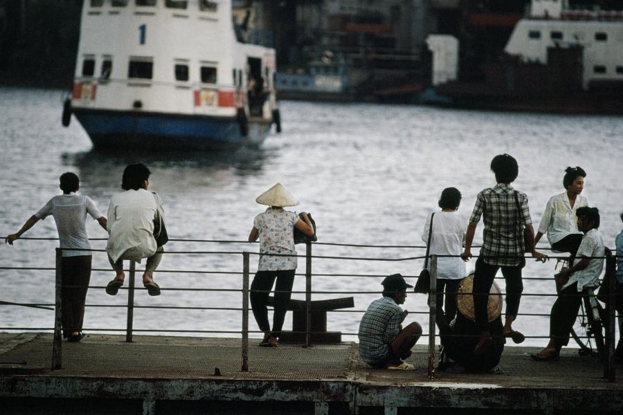 People at the dock of Saigon in 1990.
