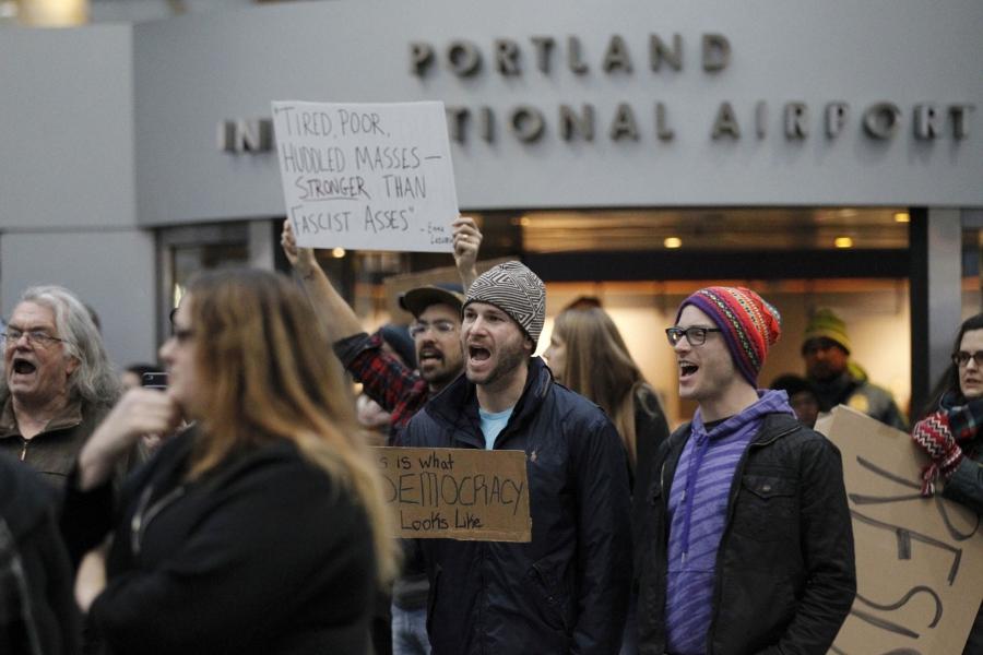 Activists gather at Portland International Airport to protest against President Donald Trump's executive action travel ban in Portland. 