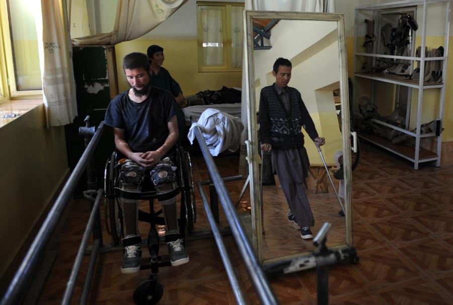 Afghan amputees practice movement with their prosthetic legs at an International Committee of the Red Cross (ICRC) hospital for war victims and the disabled in the city of Mazar-i-Sharif, Afghanistan in May 2013.