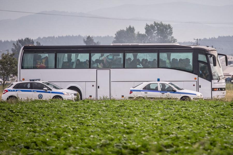 Police escort a bus from Idomeni Camp during operations to evacuate approximately 8,500 immigrants and refugees, many of whom have been there since March. 