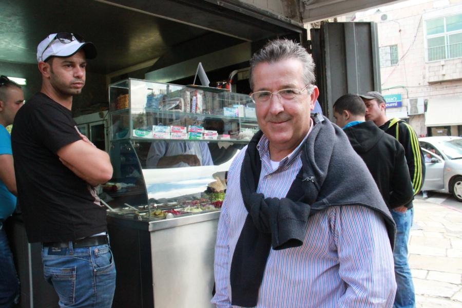 Ali Qleibo, a Palestinian anthropologist, in front of Al Waary shawarma stand in Jerusalem.