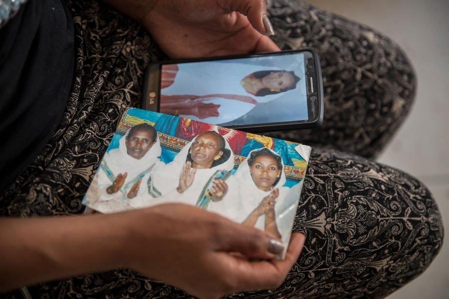 Brkitay Gebru holds photos of her sister and mother. She hasn't seen them since 2010, when she left Eritrea and undertook the dangerous journey to Israel through Egypt’s Sinai desert. She is among more than 60,000 Eritreans and Sudanese asylum seekers who