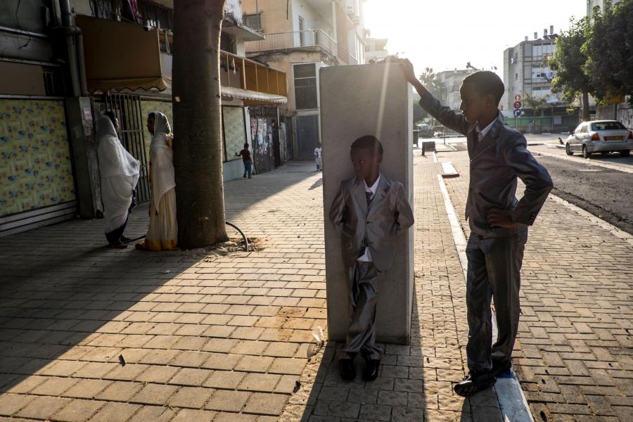 Boys gather outside an Eritrean Church in Shapira, an immigrant neighborhood of Tel Aviv.