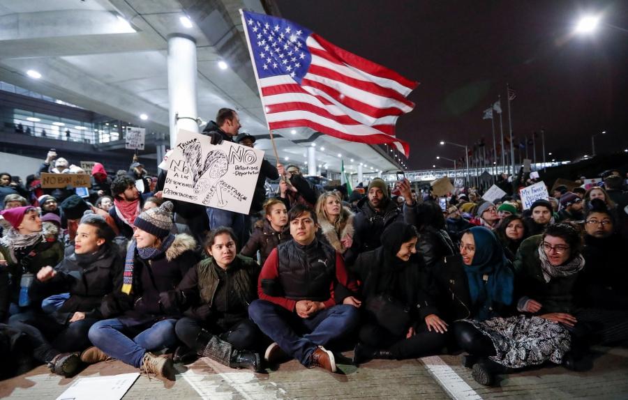 People gather to protest against the travel ban imposed by President Donald Trump's executive order, at O'Hare airport in Chicago. 