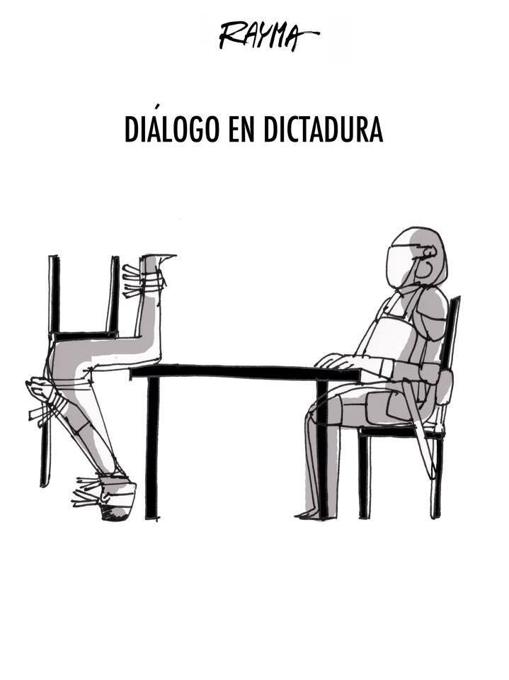 cartoon showing one person trying to talk to other person at table, but the other person is kicked off chair, to illustrate what it's like trying to deal with a dictator.
