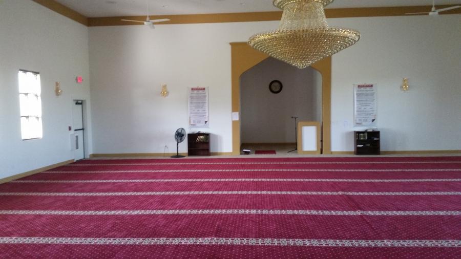 Muslim prayer space with red carpets and a chandelier in Joplin, Missouri