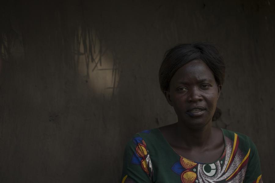 Lily Atong in front of her home in Gulu, Uganda.