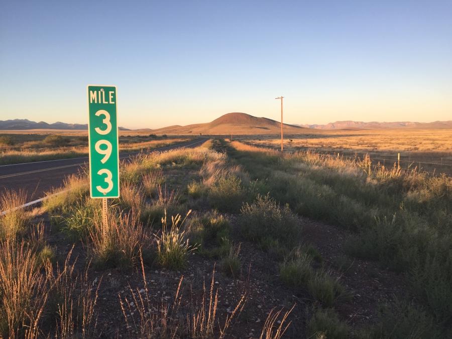 A mile marker on an empty highway