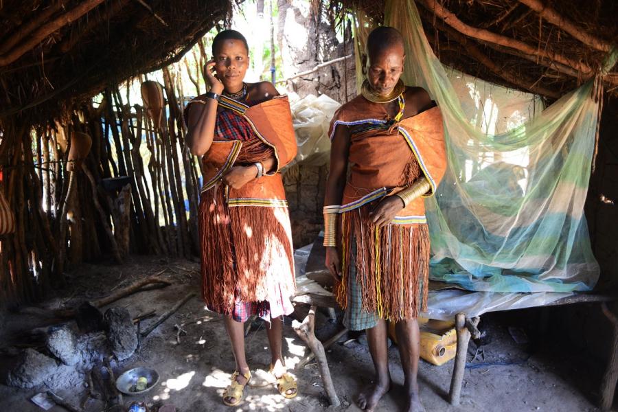 Udenda Gidaghorjod, 20, and her mother, Udangashega Wembida, 40, in traditional Barabaig dress at home. “It is the farmers who are invited to meetings about our land, not us,” said Wembida, a mother of two from Kwa Wagonzi. Now “we are threatened with the