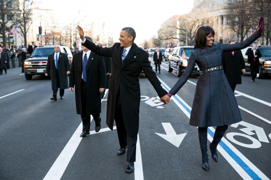 President Barack Obama and Michelle Obama walk in the inaugural parade on Pennsylvania Avenue on January 21, 2013.