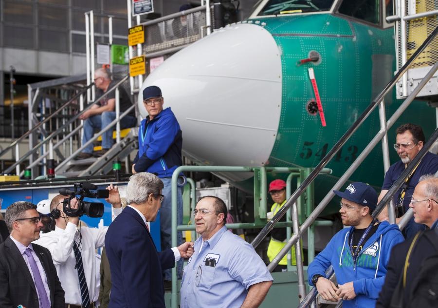 US Secretary of State John Kerry greets employees at Boeing's 737 airplane factory for a trade speech on the Trans-Pacific Partnership in Renton, Washington.