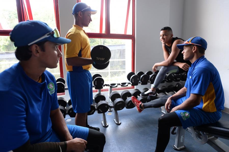 Students in the weight room, left to right: Raymond Santos, Manuel Castillo, Luis Virella, and Pedro Ottero. 